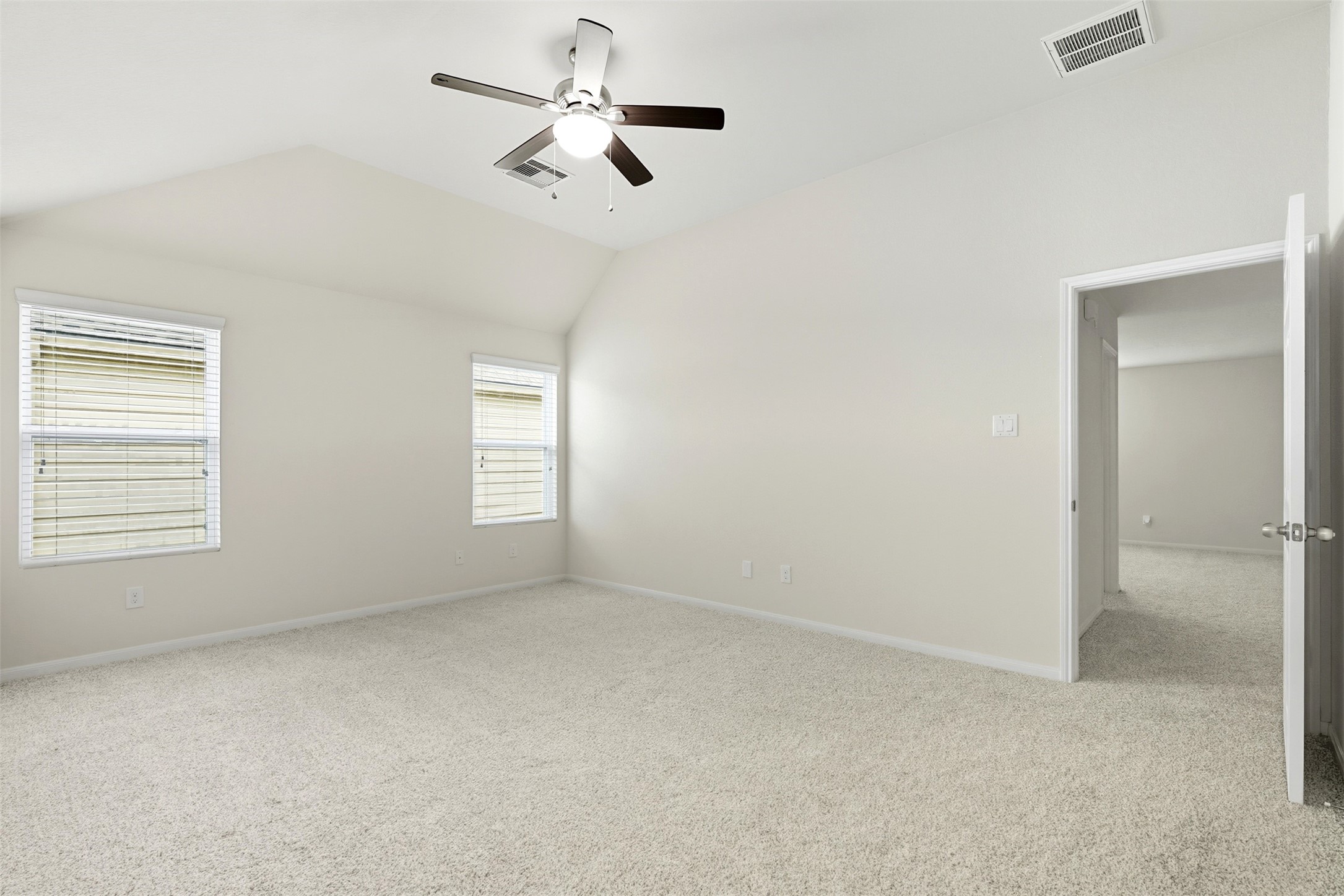 18414 West Hardy Road Houston, TX 77073 - Photo 24 of 46 an empty room with ceiling fan and window