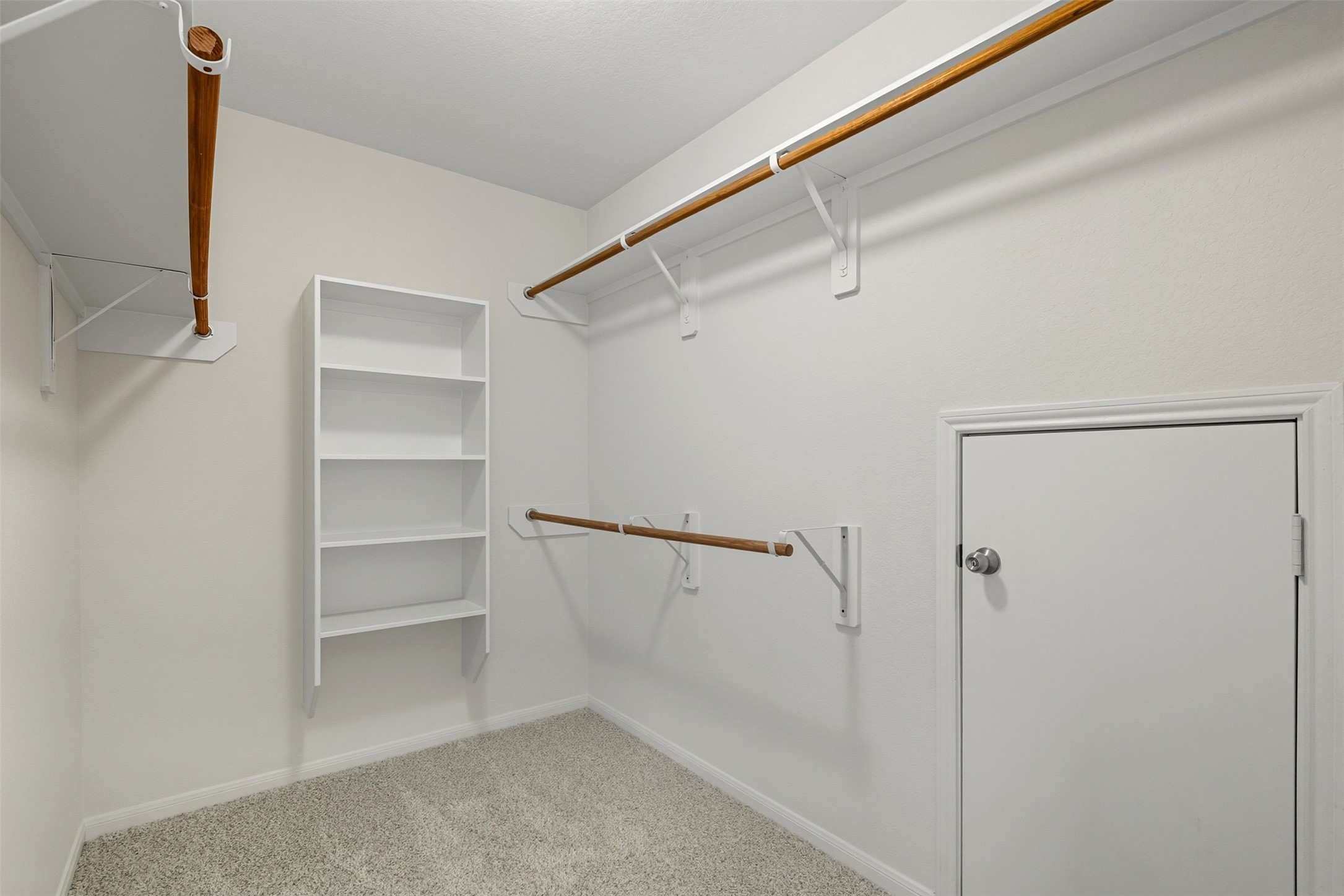 18414 West Hardy Road Houston, TX 77073 - Photo 27 of 46 a view of an empty walk in closet