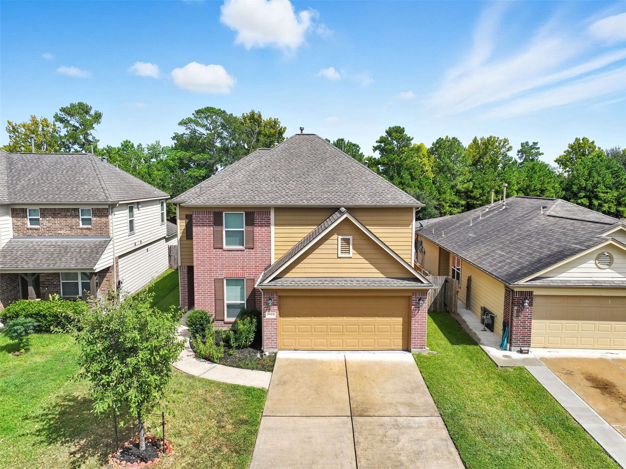 18414 West Hardy Road Houston, TX 77073 - Photo 37 of 46 a front view of a house with a yard