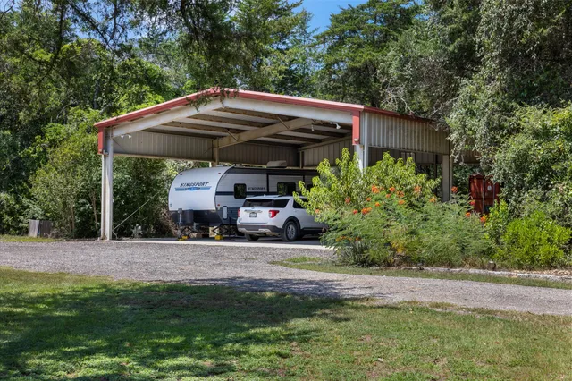 a view of a car parked in front of house