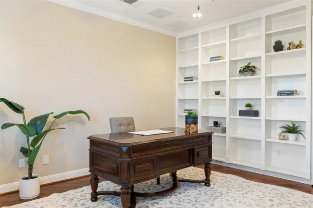 a room with a table and a potted plant