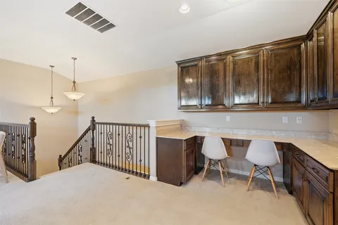 a view of a kitchen with furniture and a window