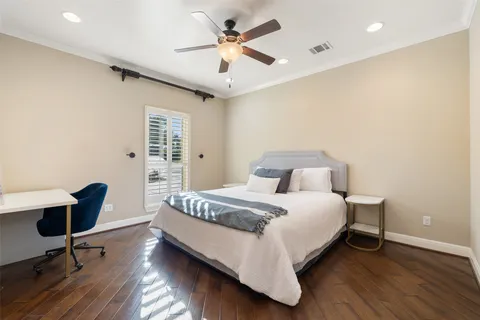 a bathroom with a granite countertop double vanity sink and a mirror