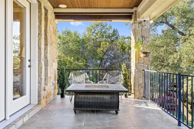 front view of a brick house with potted plants