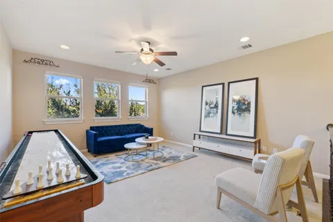 a living room with furniture and window