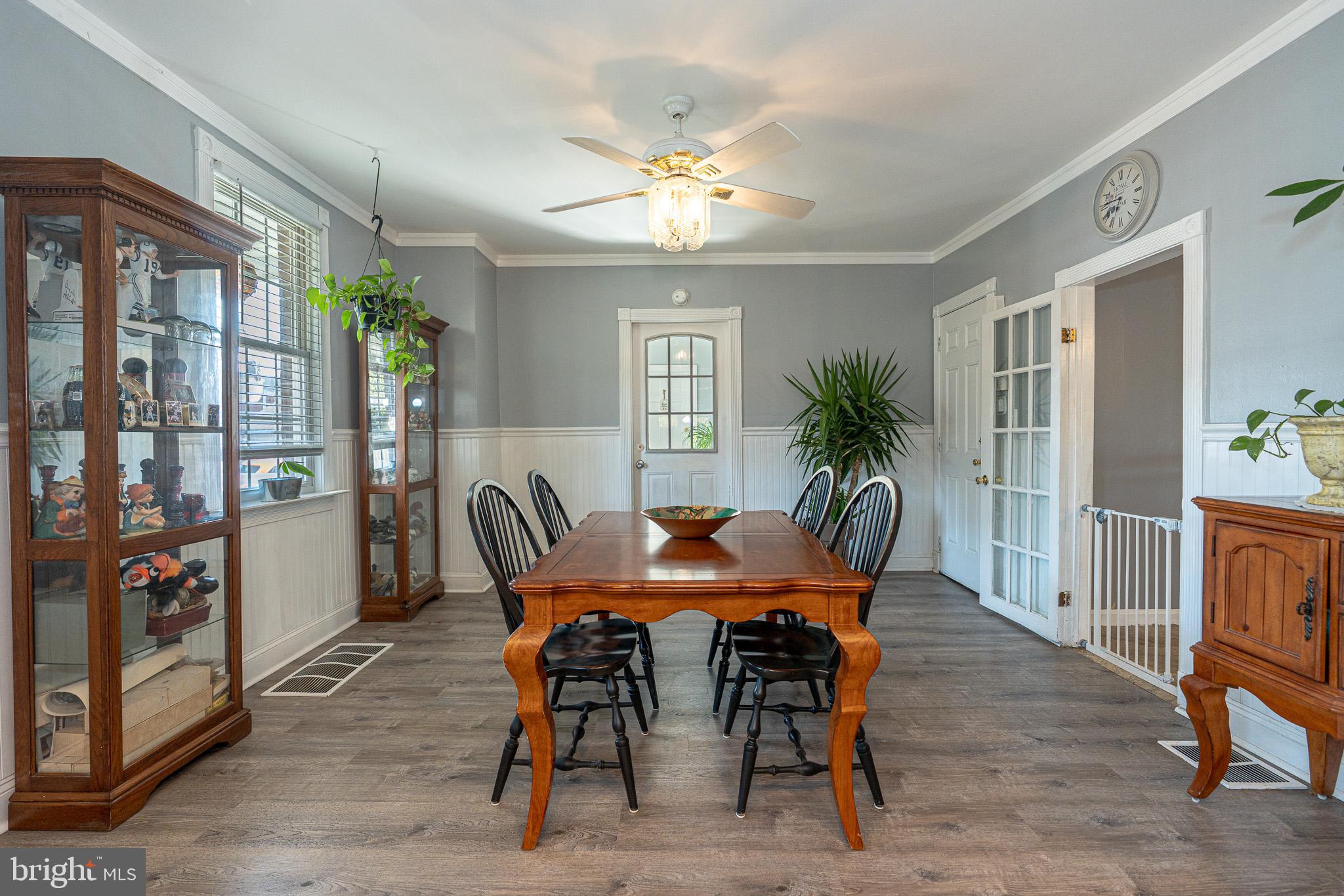 8514 Sandy Plains Road Dundalk, MD 21222 - Photo 11 of 34 a view of a dining room with furniture and chandelier