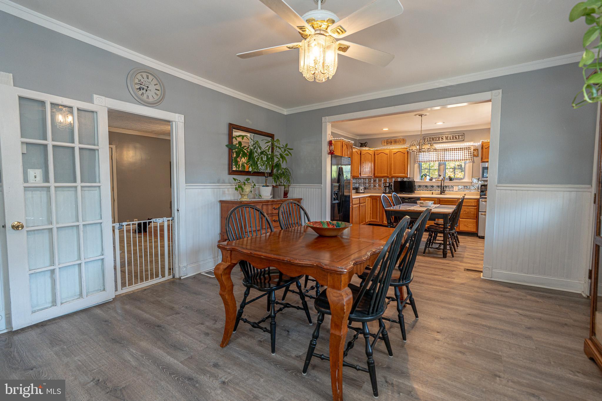 8514 Sandy Plains Road Dundalk, MD 21222 - Photo 12 of 34 a view of a dining room with furniture window and wooden floor