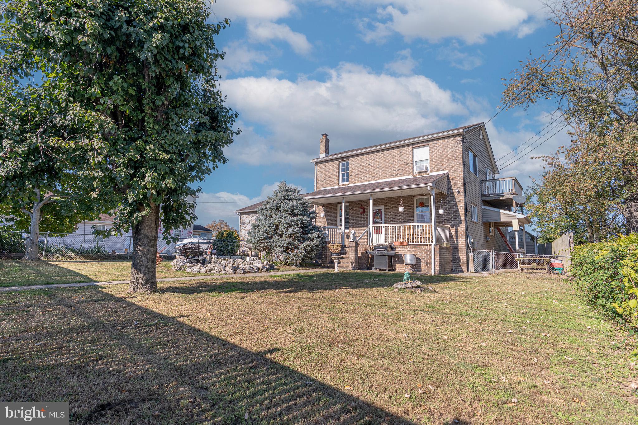 8514 Sandy Plains Road Dundalk, MD 21222 - Photo 2 of 34 a front view of a house with a yard