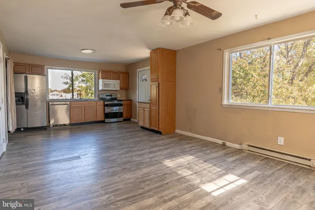 a view of a kitchen with a sink and a window