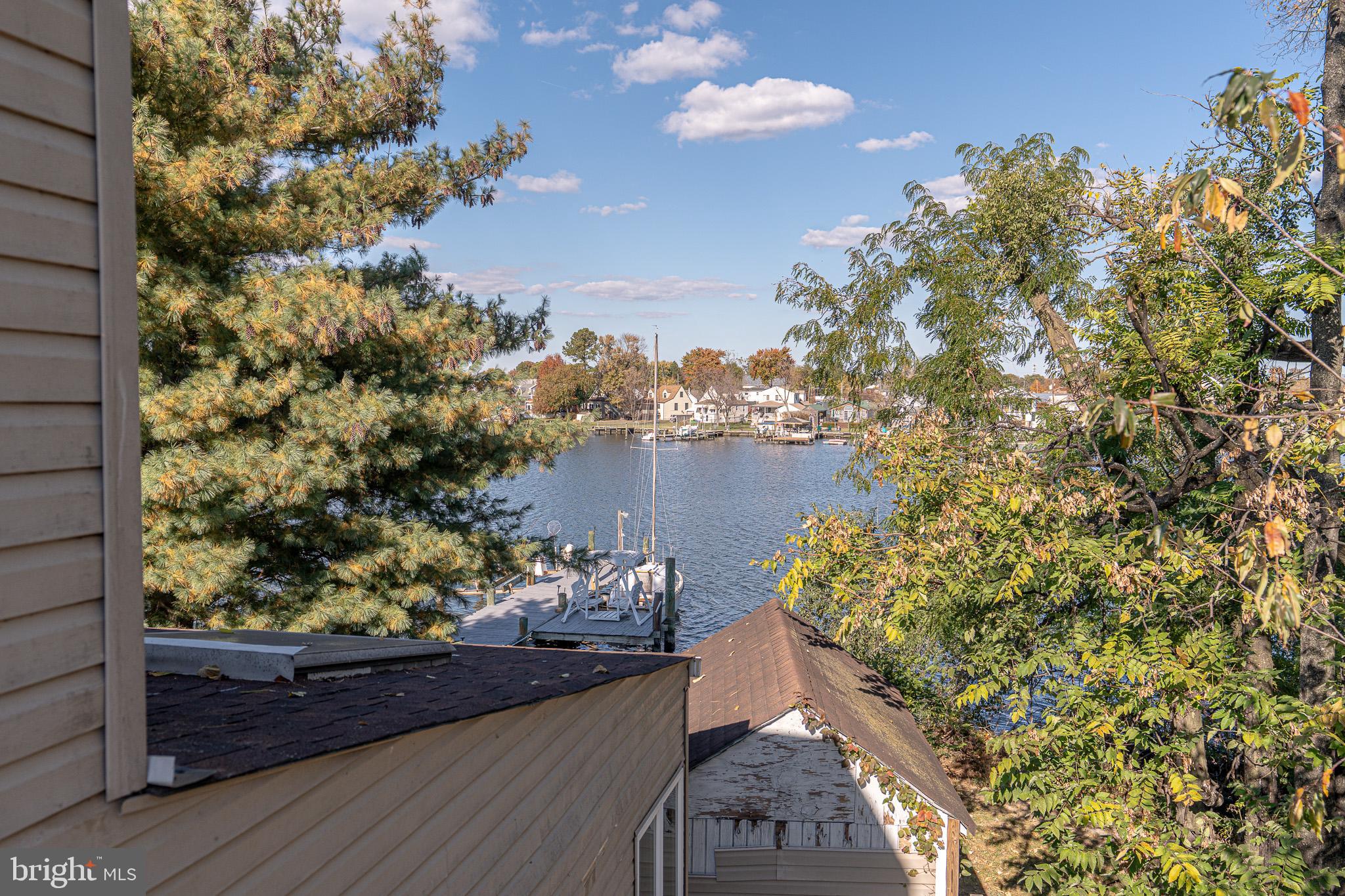 8514 Sandy Plains Road Dundalk, MD 21222 - Photo 24 of 34 a view of a lake with a sitting area