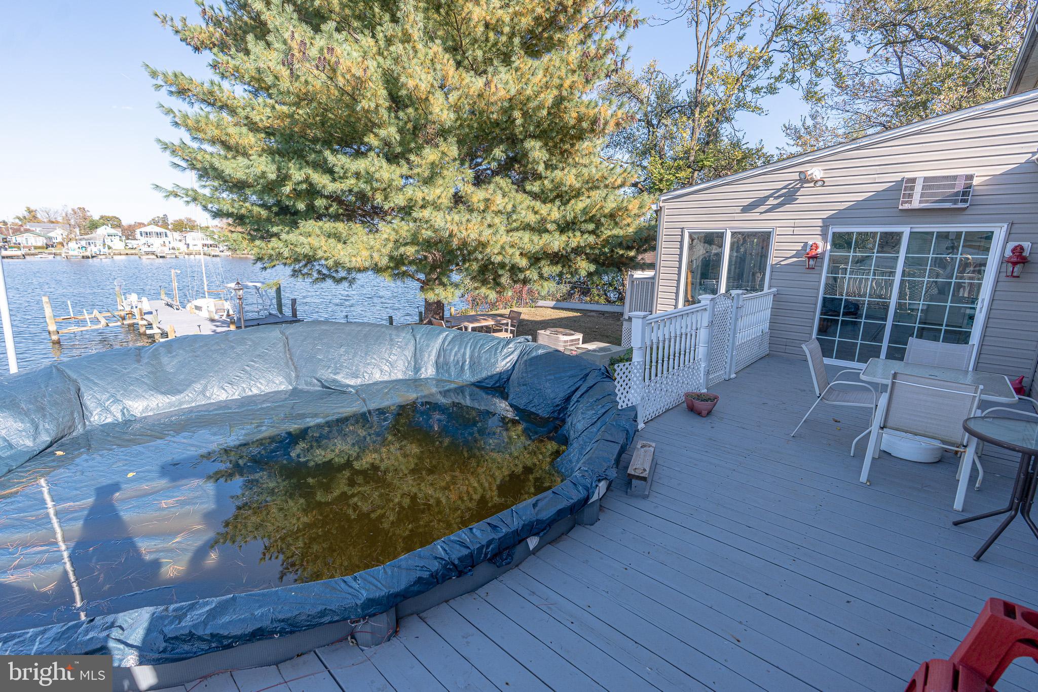 8514 Sandy Plains Road Dundalk, MD 21222 - Photo 32 of 34 a view of a swimming pool with lounge chair