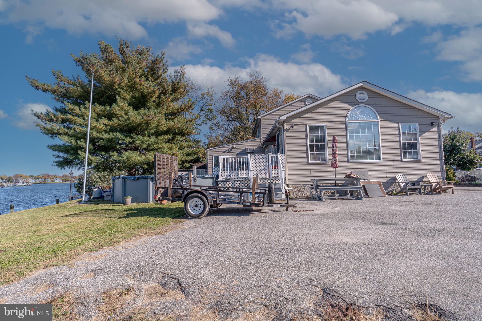 8514 Sandy Plains Road Dundalk, MD 21222 - Photo 8 of 34 a view of a house with a yard and sitting area