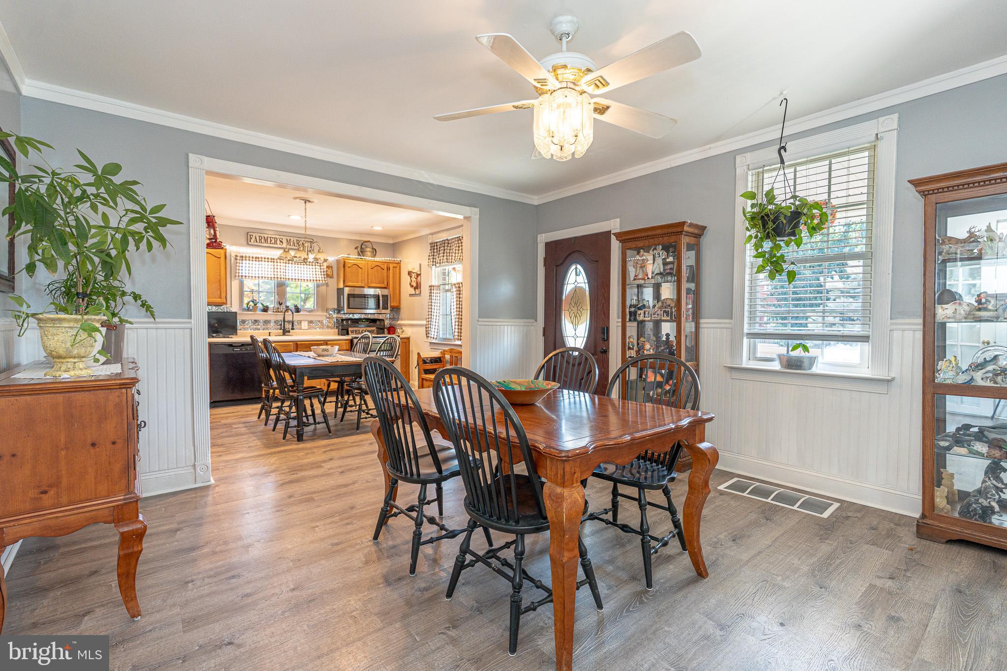 8514 Sandy Plains Road Dundalk, MD 21222 - Photo 10 of 34 a view of a dining room with furniture window and wooden floor