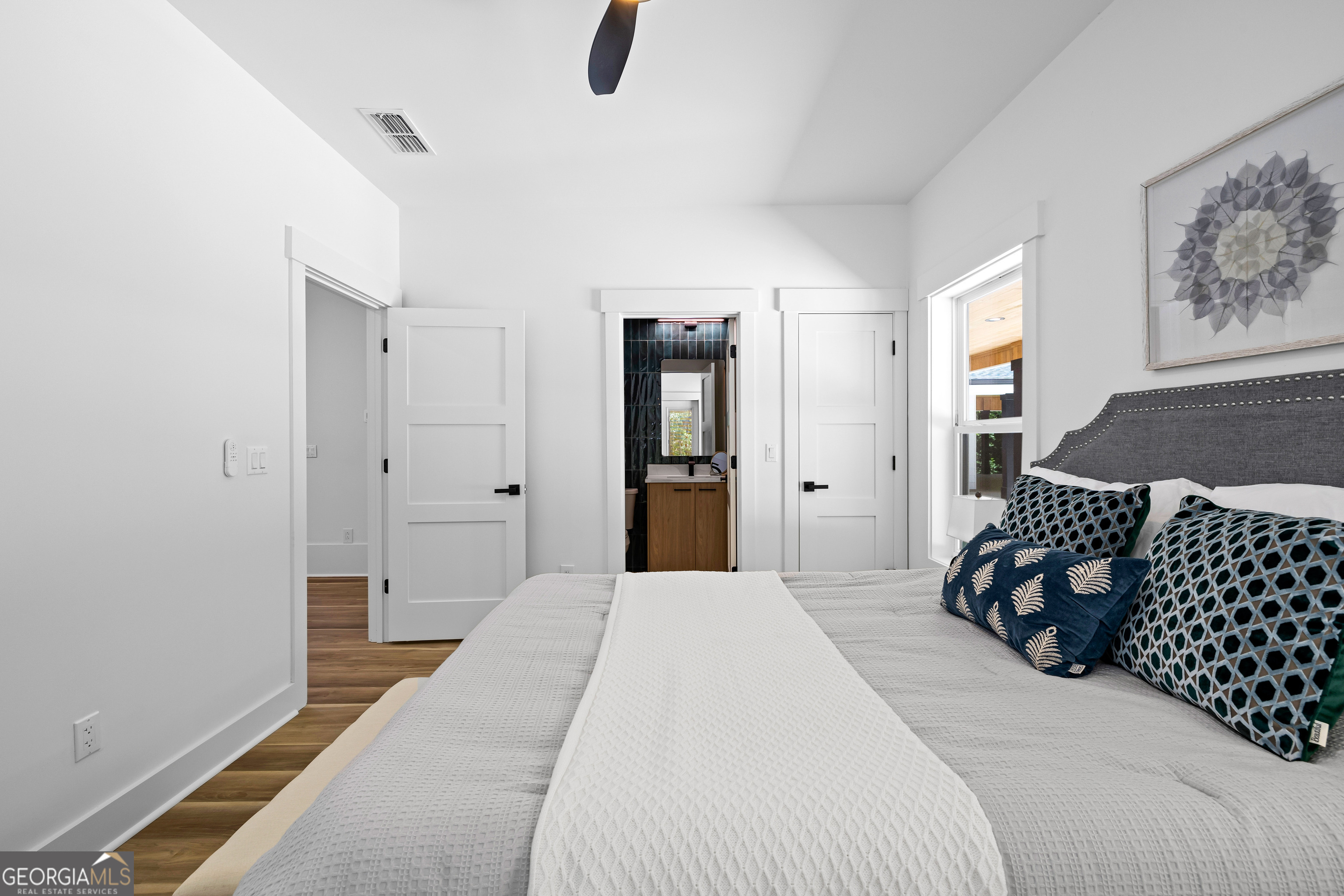 354 Turner Road Newnan, GA 30263 - Photo 47 of 79 a bedroom with a bed and painting on the wall