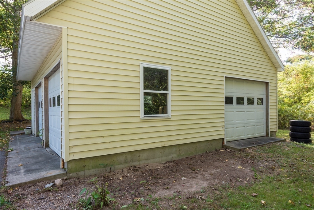 39 Route 130 Forestdale, MA 02644 - Photo 20 of 29 a view of a house with a yard and garage
