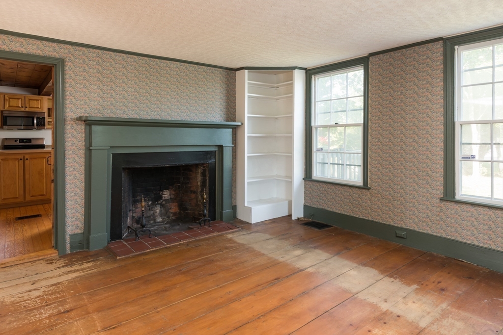 39 Route 130 Forestdale, MA 02644 - Photo 4 of 29 an empty room with windows and fireplace