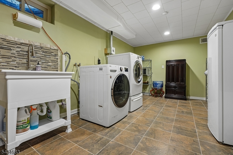 106 Division Avenue Summit, NJ 07901 - Photo 30 of 38 a utility room with dryer and washer