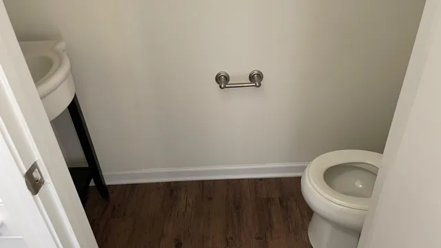 a close up of a toilet in a small bathroom