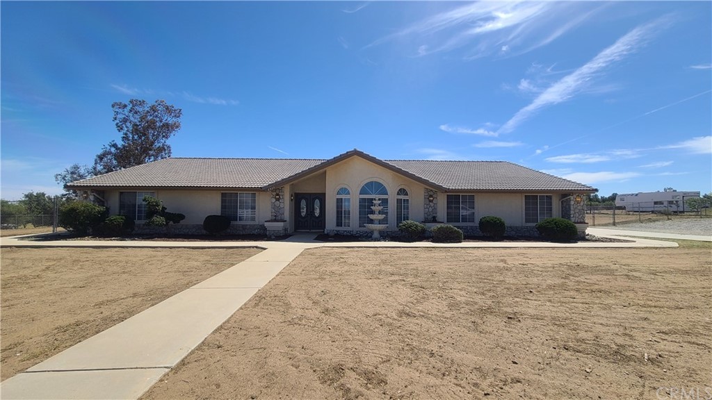 8423 Arrowhead Road Phelan, CA 92371 - Photo 1 of 1 a front view of a house with yard