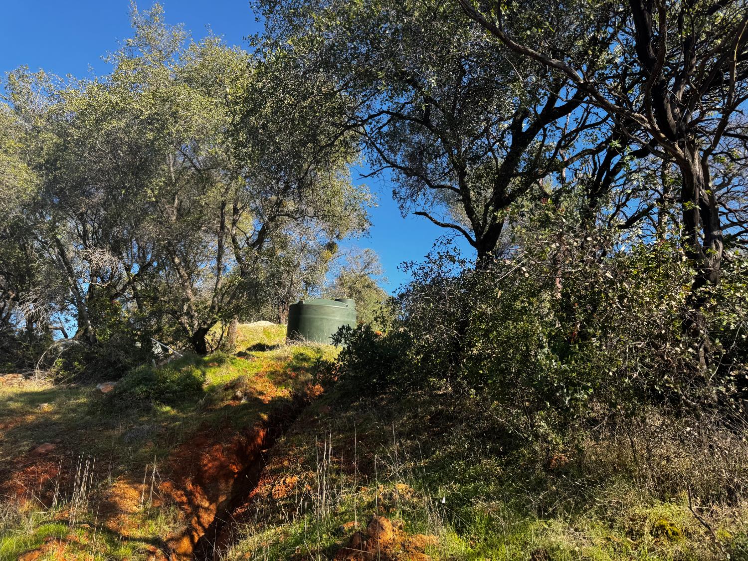 15806 Perimeter Road Grass Valley, CA 95949 - Photo 23 of 32 Trenching is complete for the electrical for the septic. All that is needed is the conduit and electrical tie in.