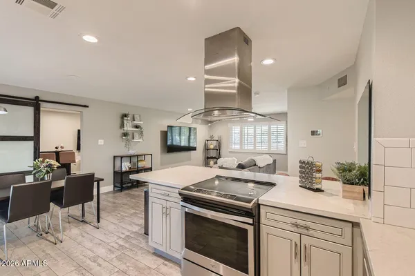 a kitchen with a sink stove and cabinets