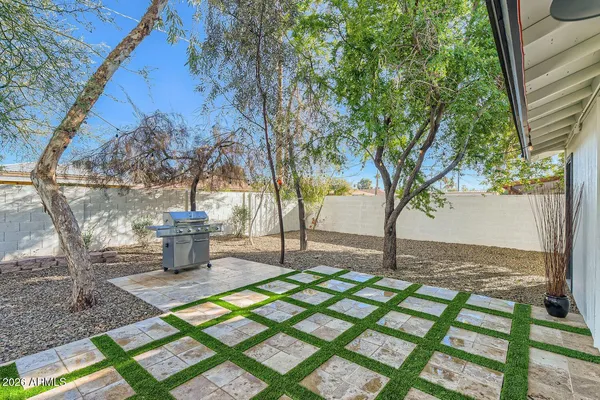 a view of a backyard with large trees