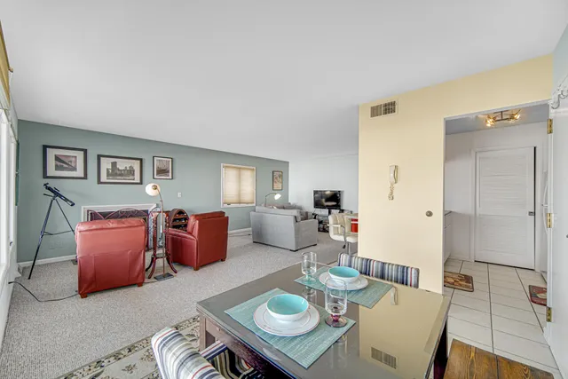 a large kitchen with kitchen island a sink and a stove top oven