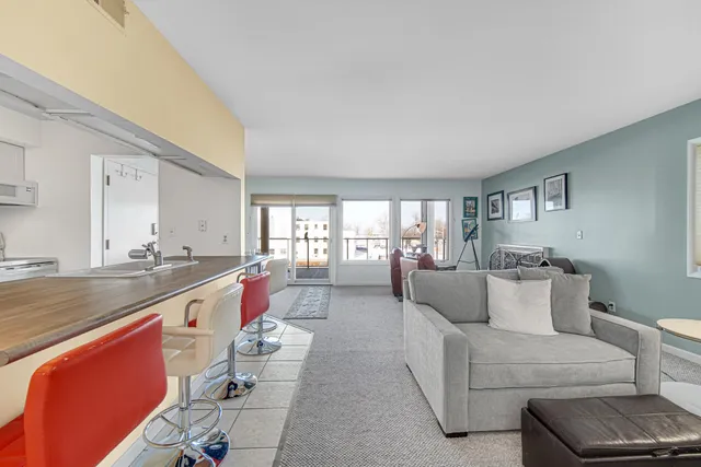 a bedroom with a bed and a chair