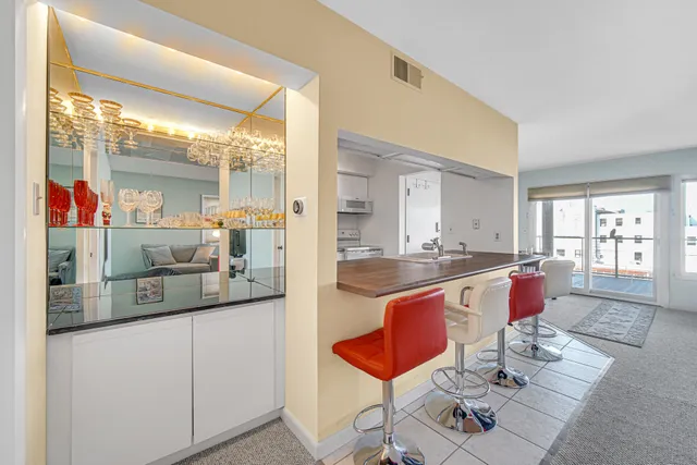 a bedroom with a bed and a dresser in it