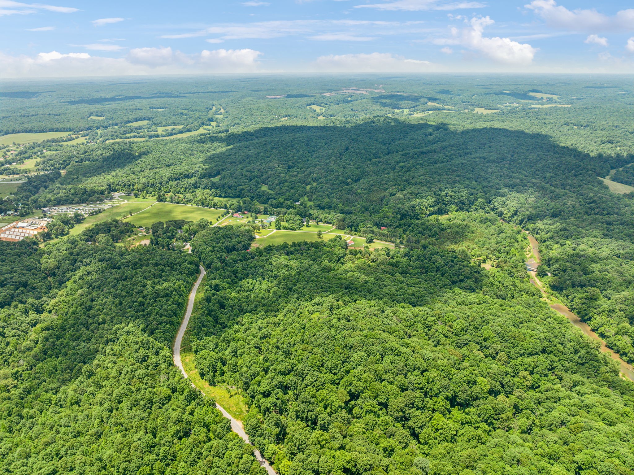 0 Piney River Road Bon Aqua, TN 37025 - Photo 9 of 19 a view of a green field with lots of bushes