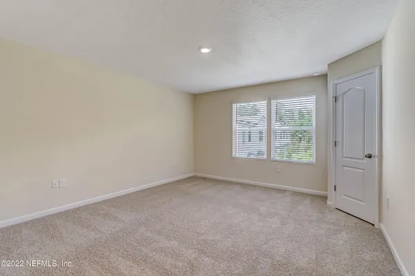 an empty room with a bathroom