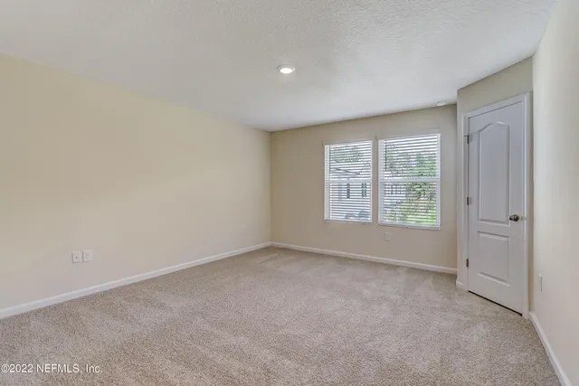 an empty room with a bathroom