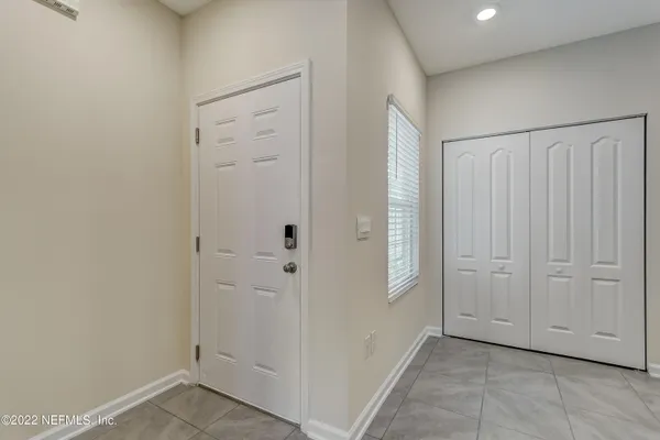 an empty room with closet area