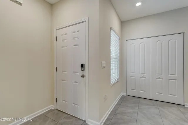 an empty room with closet area