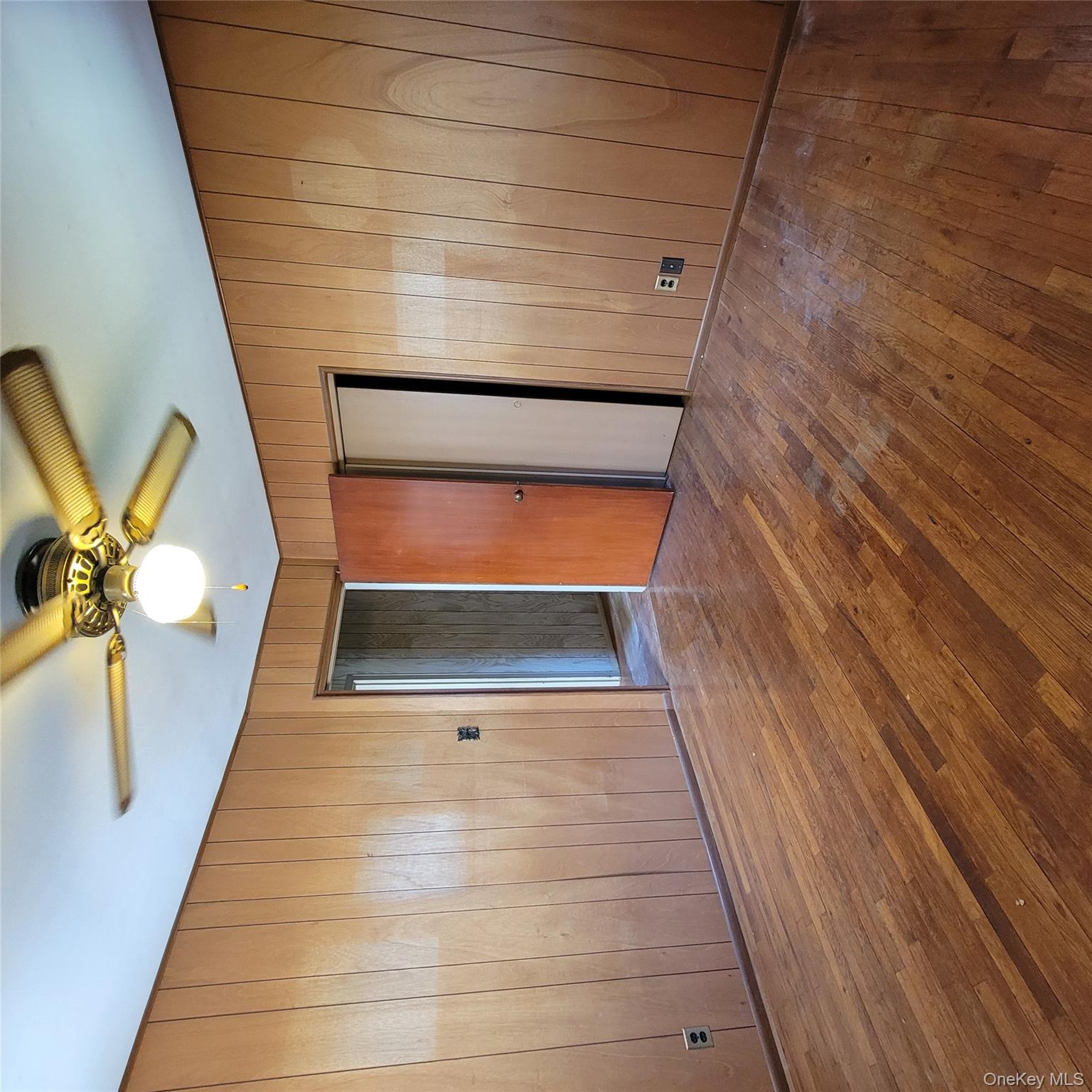 3030 North Jerusalem Road Wantagh, NY 11793 - Photo 11 of 14 an empty room with windows and ceiling fan