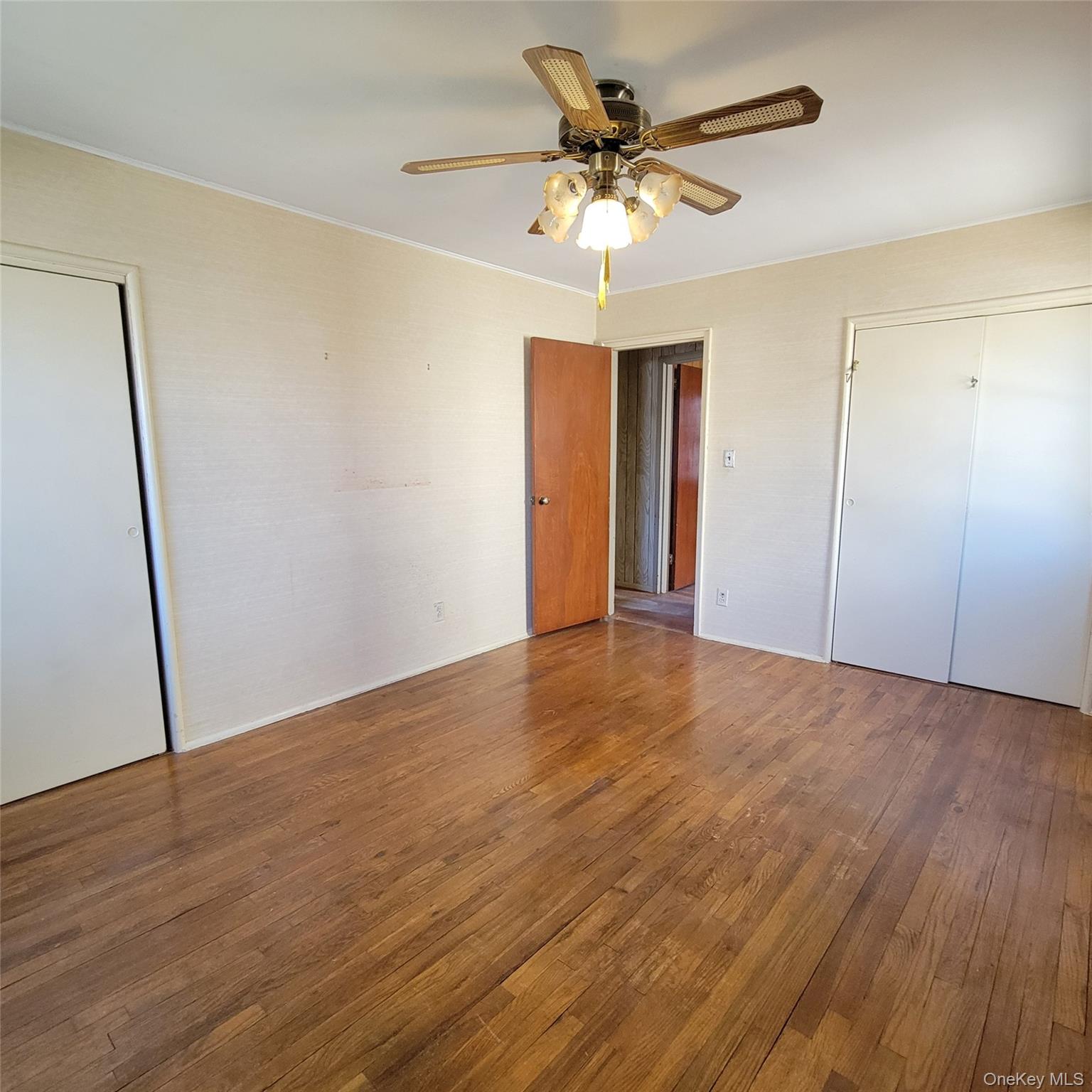 3030 North Jerusalem Road Wantagh, NY 11793 - Photo 13 of 14 a view of an empty room with wooden floor