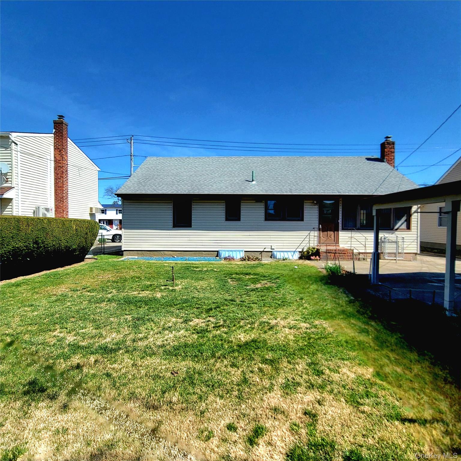 3030 North Jerusalem Road Wantagh, NY 11793 - Photo 14 of 14 a front view of a house with garden