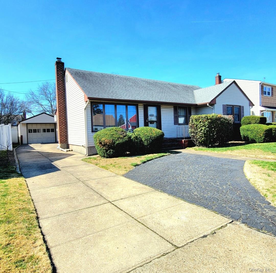 3030 North Jerusalem Road Wantagh, NY 11793 - Photo 2 of 14 a front view of a house with garden