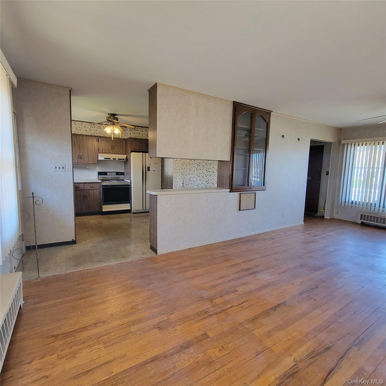 3030 North Jerusalem Road Wantagh, NY 11793 - Photo 6 of 14 a view of a kitchen with a sink and a refrigerator