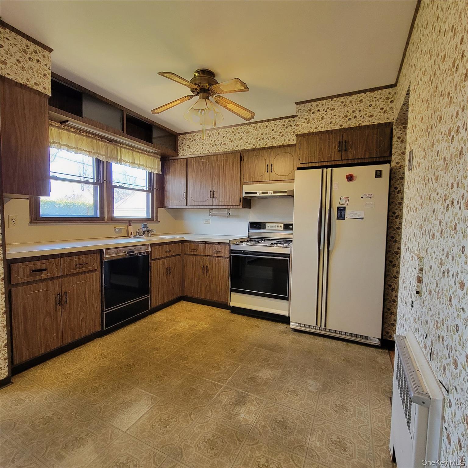 3030 North Jerusalem Road Wantagh, NY 11793 - Photo 8 of 14 a kitchen with stainless steel appliances a refrigerator sink and stove