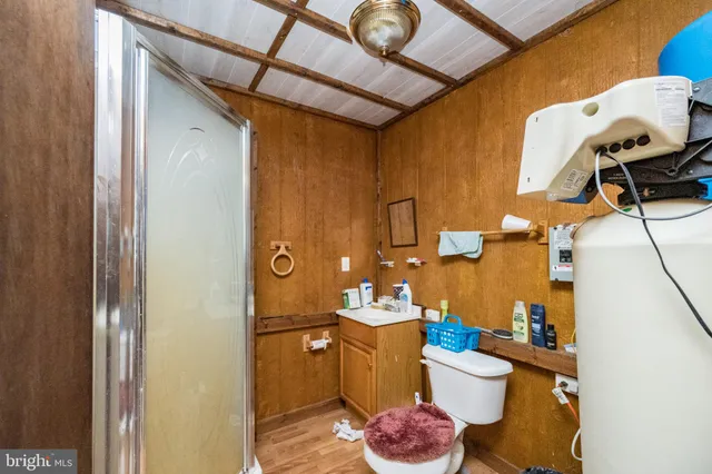 a bed room with a bed and a mirror