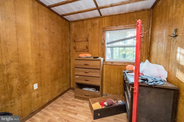 a spacious bedroom with a bed and a window