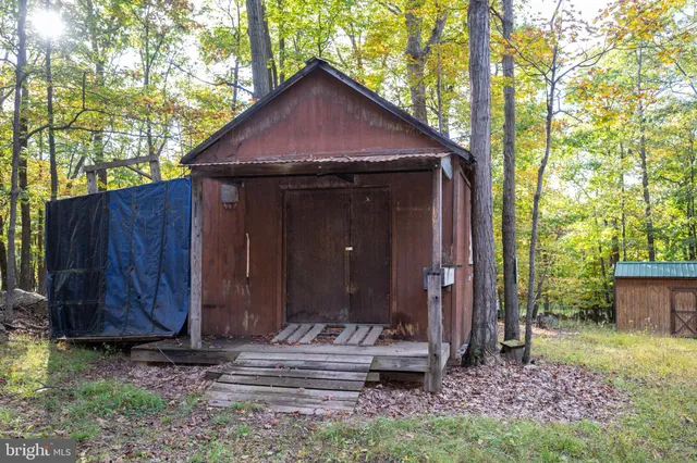 a big yard with lots of green space and house
