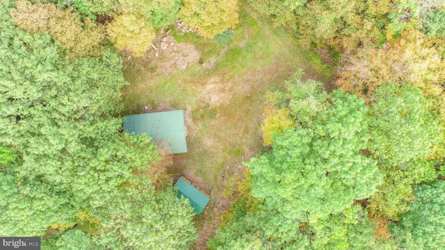a view of a kitchen with microwave and furniture