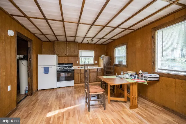 a kitchen with a stove a refrigerator and a stove