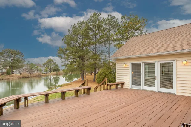 a view of a house with wooden deck