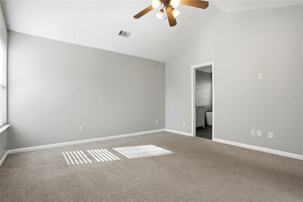 2157 Capella Circle Southwest Atlanta, GA 30331 - Photo 13 of 41 an empty room with a chandelier fan