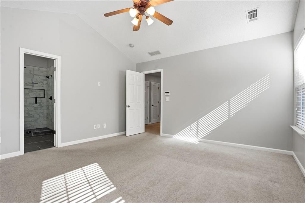 2157 Capella Circle Southwest Atlanta, GA 30331 - Photo 14 of 41 a view of an empty room with a chandelier fan