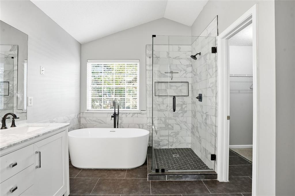 2157 Capella Circle Southwest Atlanta, GA 30331 - Photo 15 of 41 a bathroom with a sink and a shower