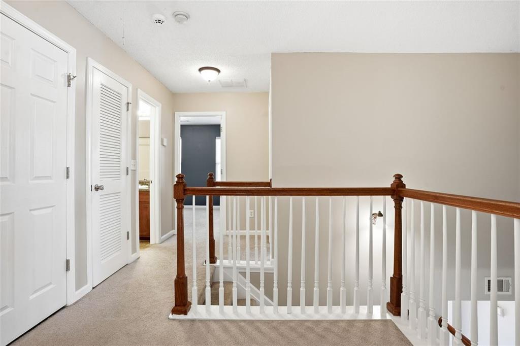 2157 Capella Circle Southwest Atlanta, GA 30331 - Photo 18 of 41 a view of a hallway with wooden floor and a bathroom